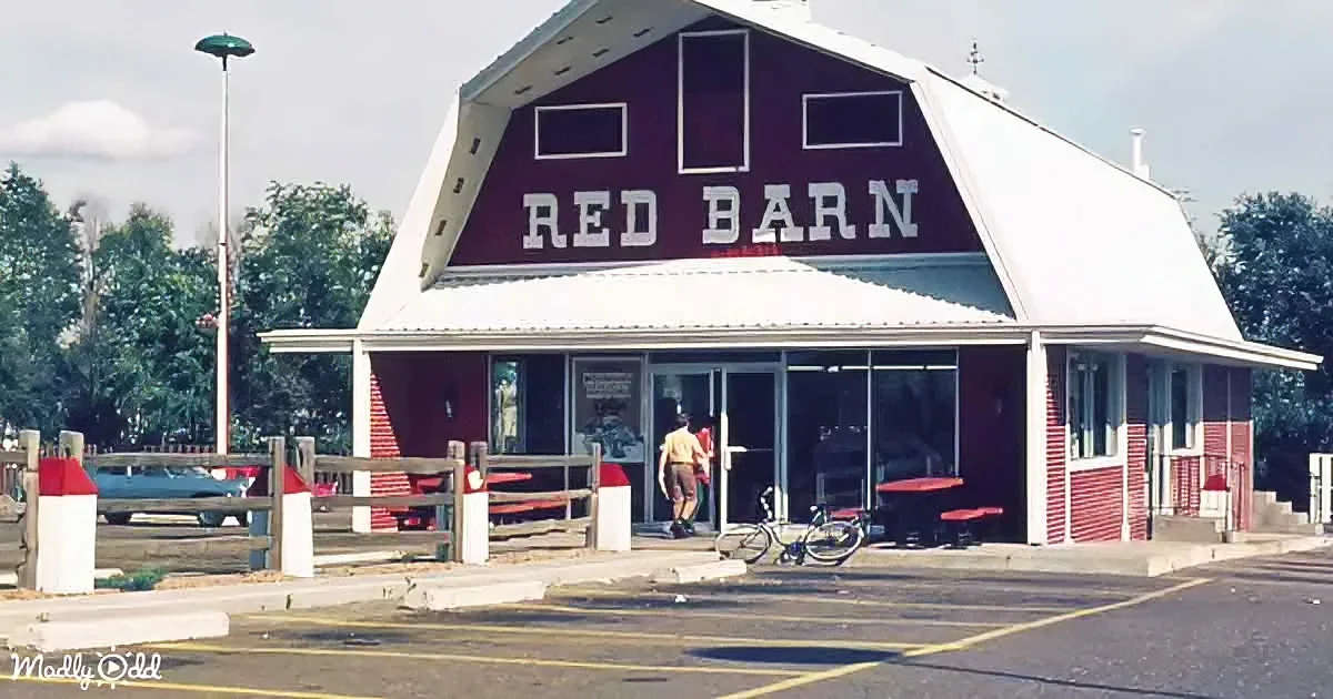 A red barn-style building with "RED BARN" sign, white trim, and outdoor seating area.