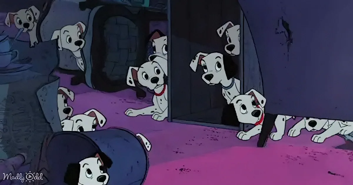 Dalmatian puppies peek out from behind a door in a dimly lit room.