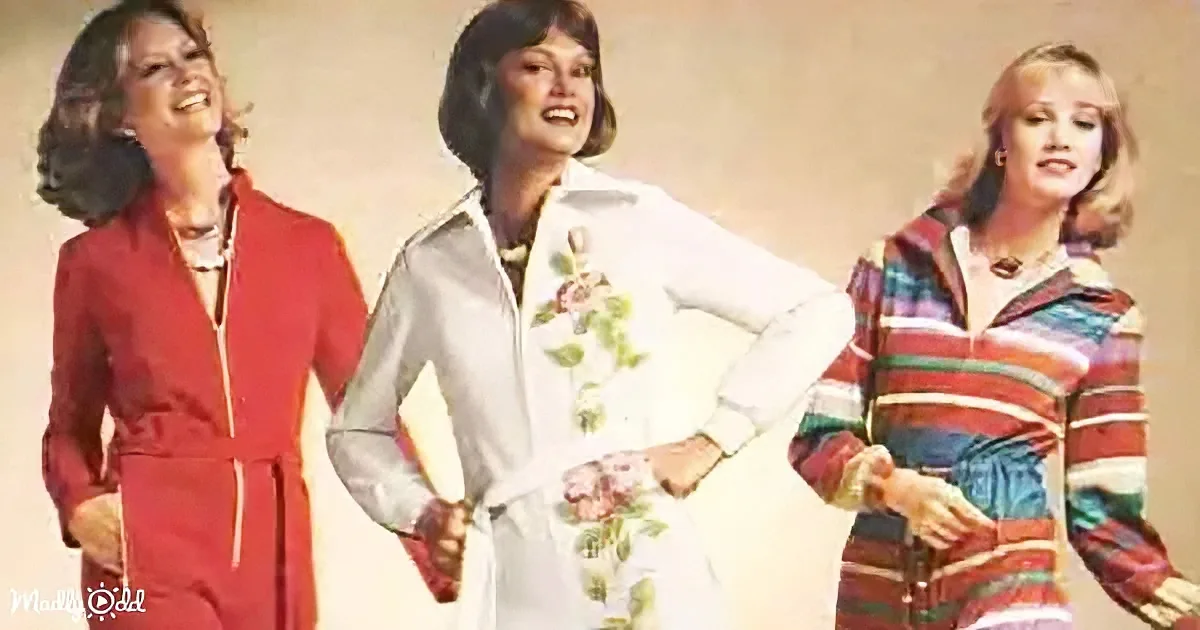 Three women in 1970s fashion, smiling, wearing vibrant outfits, posing together.