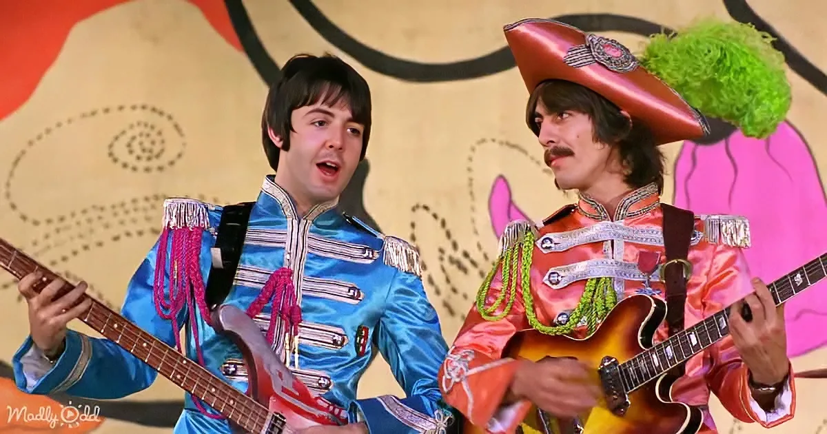 Two musicians in colorful uniforms play guitars, one singing, against a vibrant, abstract background.