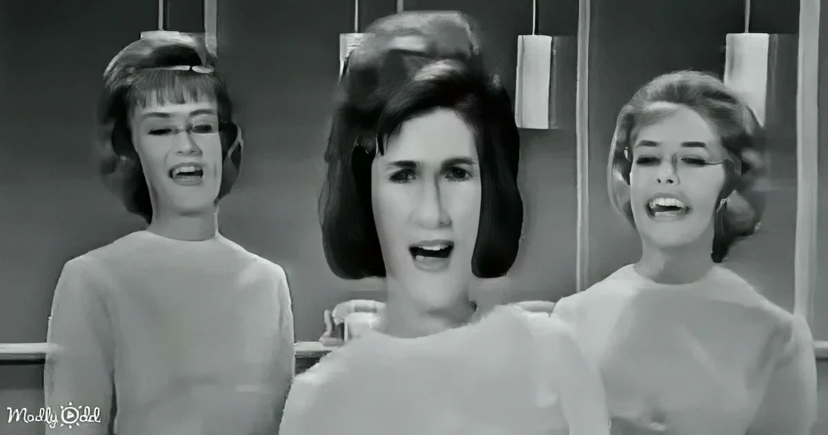 Three women in mid-song, mid-20th century style, with expressive faces and period clothing.