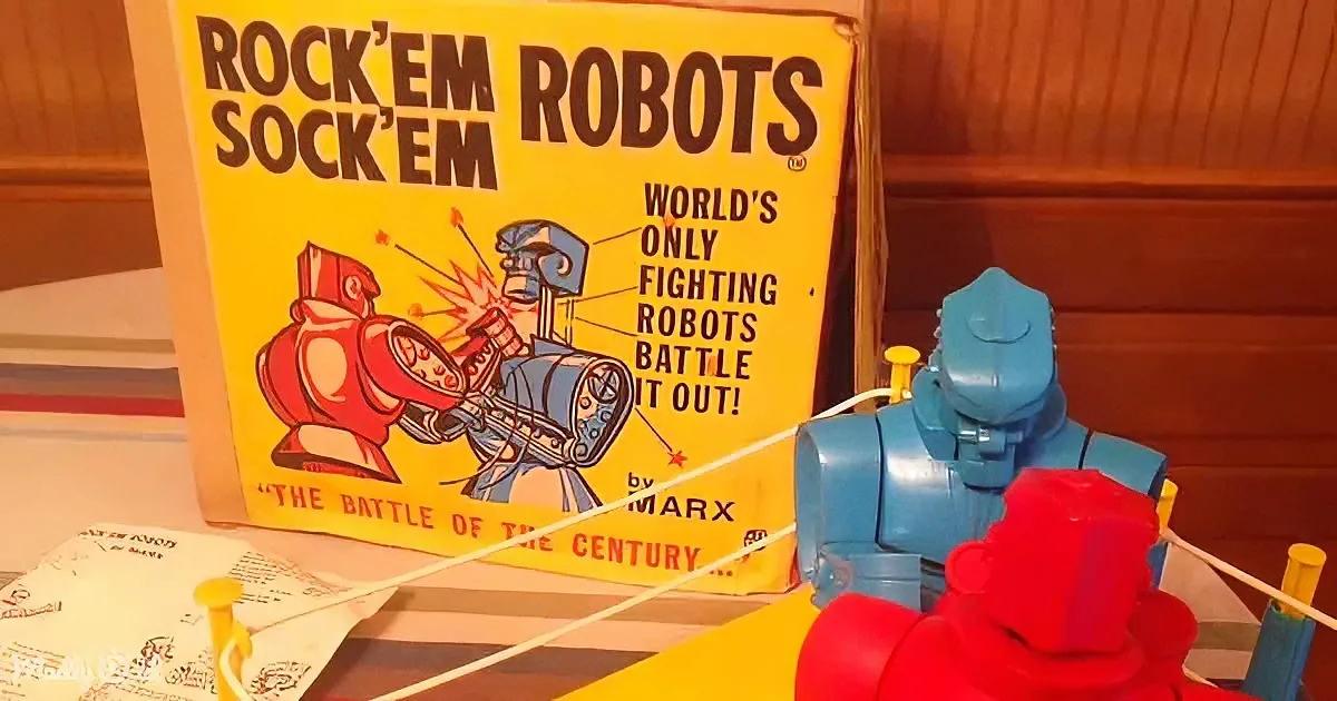 Rock 'em Sock 'em Robots toy set with red and blue figures and box.