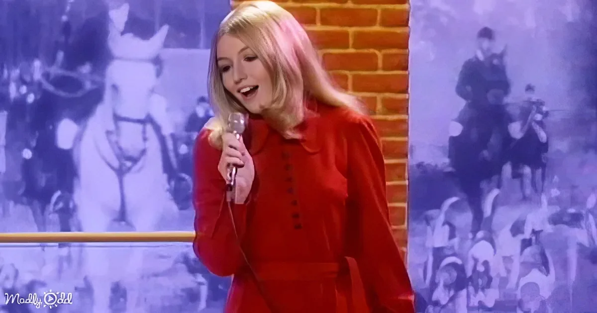 A woman in a red outfit sings into a microphone, with a brick wall and vintage images in the background.
