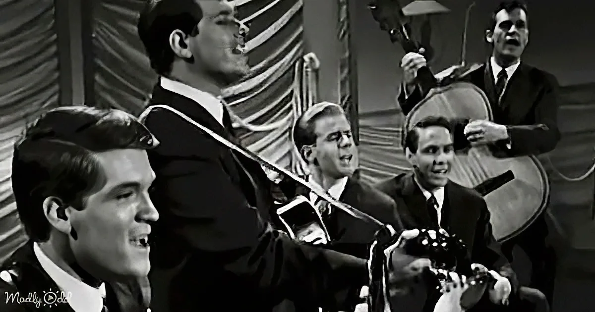 A man in a suit plays violin, surrounded by other musicians in a vintage setting.