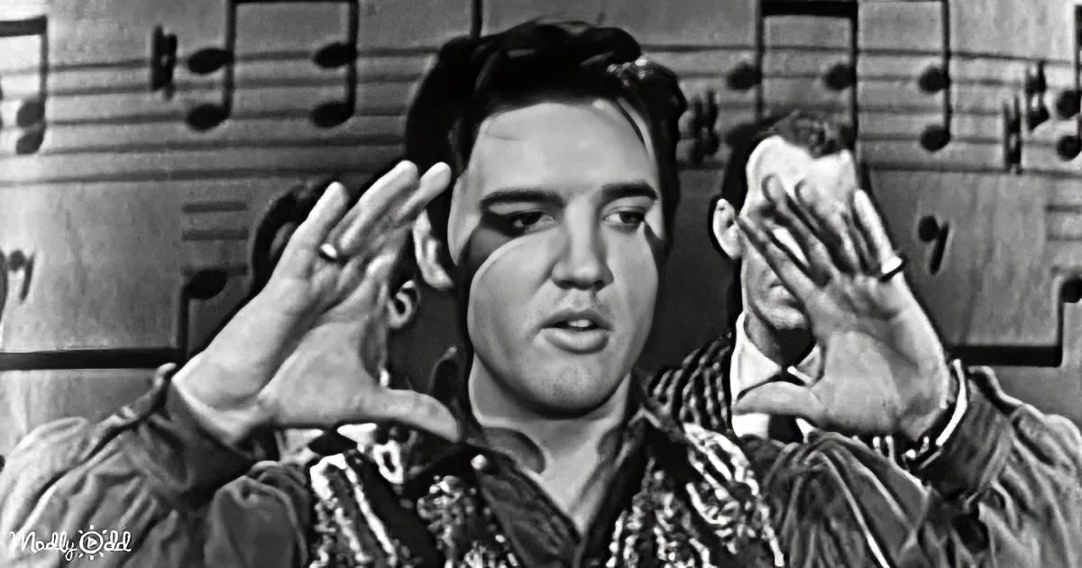 Elvis Presley in a black-and-white scene with musical notes in the background, hands raised.