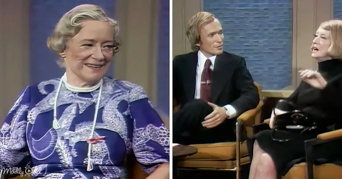 A woman in a blue patterned dress smiles, while another woman in a black outfit gestures during a talk show.