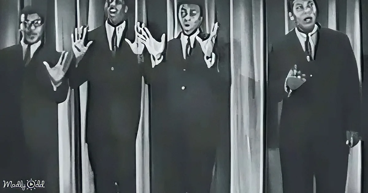 Four men in suits sing with expressive gestures against a striped background.