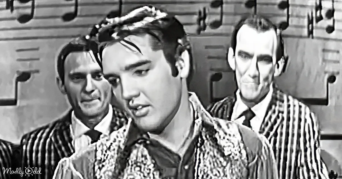 Elvis Presley in a black-and-white scene, wearing a patterned shirt, with musical notes in the background.