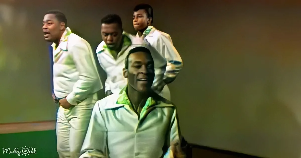 A man in a white and green tracksuit is being carried by two others in a similar outfit.