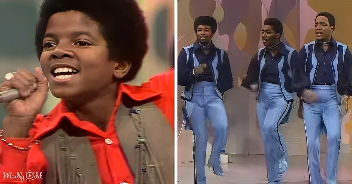 A young boy in a red shirt sings passionately, while three men in blue outfits dance in the background.