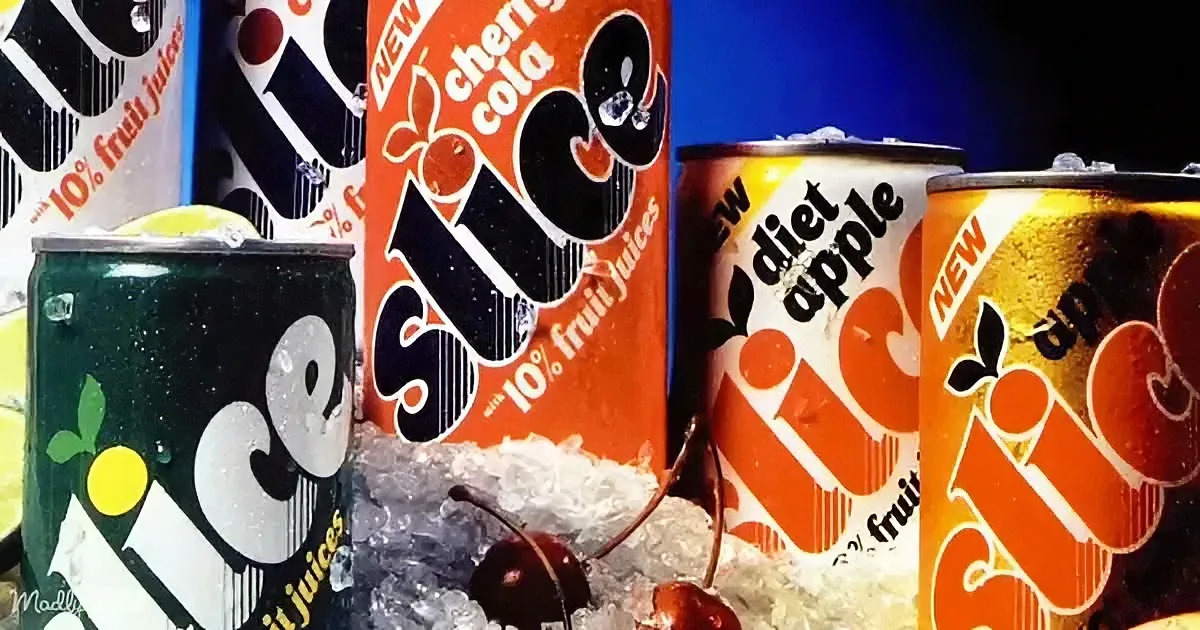 Ice Juice cans with cherry cola, diet apple, and other flavors displayed with ice and cherries.