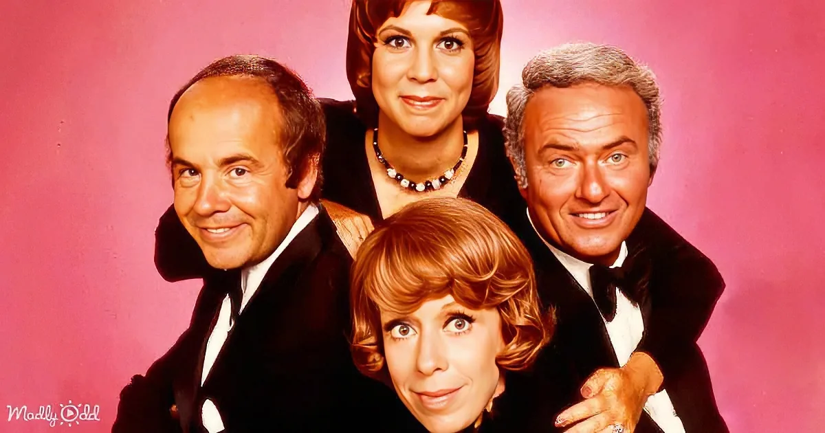 Four smiling actors in formal attire pose together against a pink background.