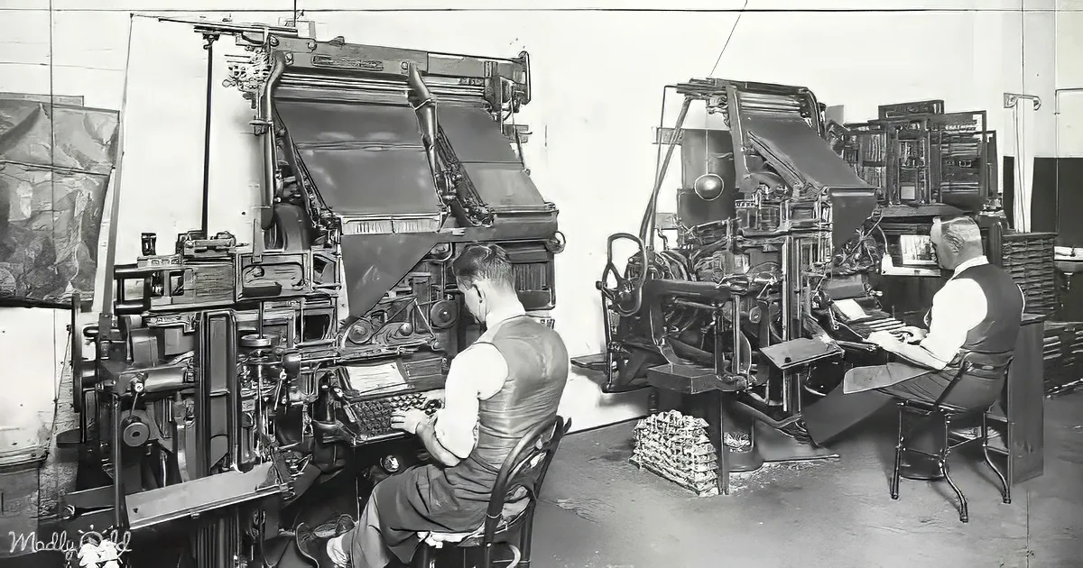 Two men operate large printing presses in a vintage printing shop, surrounded by machinery and paper.