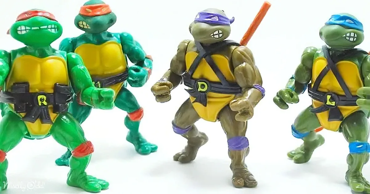 Four Teenage Mutant Ninja Turtles action figures in various poses, wearing colorful bandanas and yellow vests.