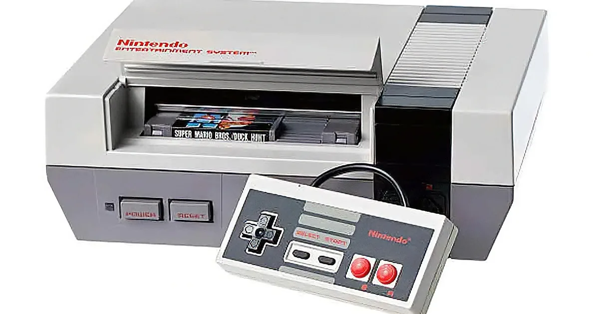 A Nintendo Entertainment System console with a game cartridge inserted and a classic controller in front.