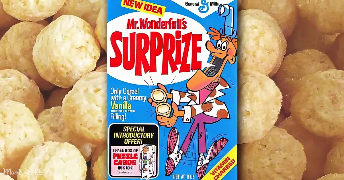 Mr. Wonderfull's Surprize cereal box with a cartoon character holding a treat, surrounded by cereal pieces.