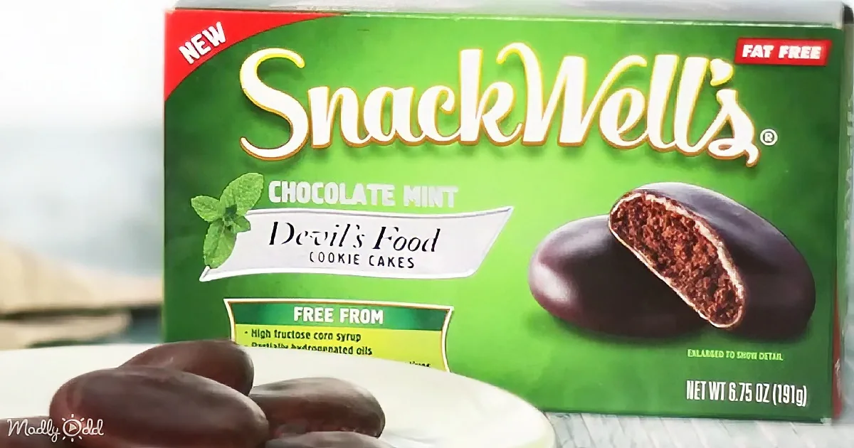 A SnackWell's Chocolate Mint Devil's Food Cookie Cakes box with a mint leaf and a plate of cookies in front.