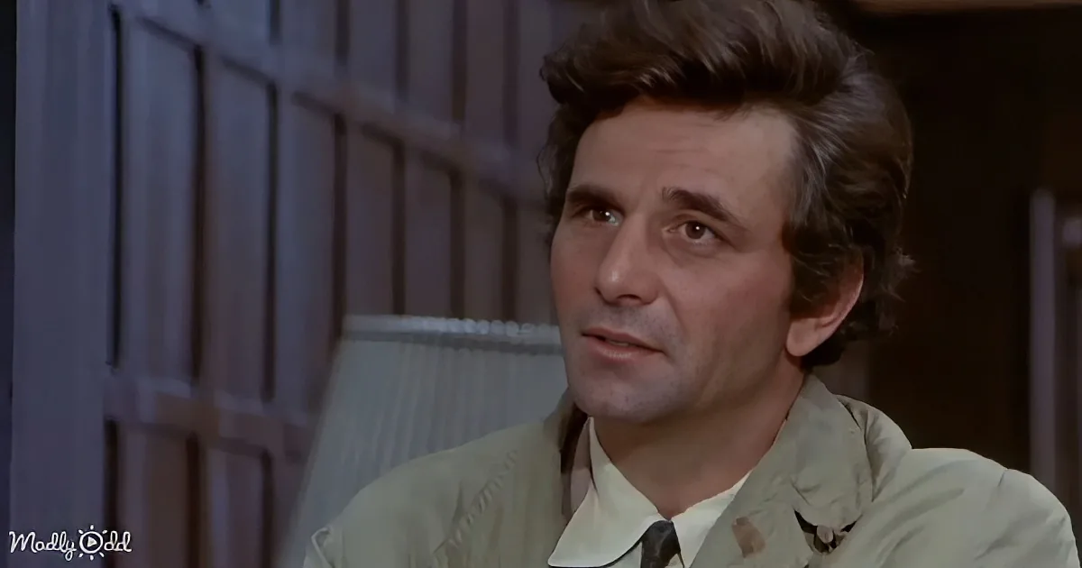 A man with dark, curly hair wearing a light-colored shirt and tie, looking to the side with a serious expression.