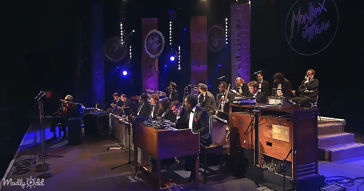 A jazz band in formal attire performs on stage at the Montreux Jazz Festival.