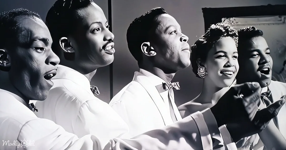 A group of five individuals in formal attire, singing or speaking, with a vintage aesthetic.