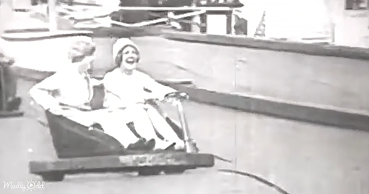 A woman in a white dress and hat is joyfully riding a small boat on a river.