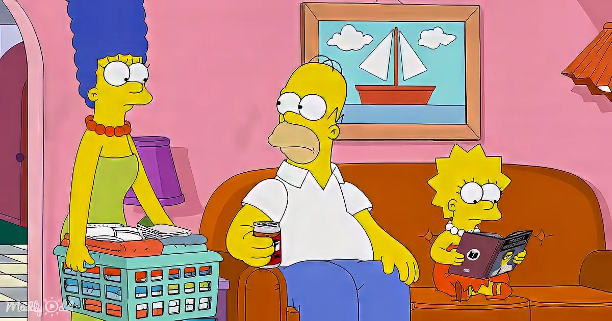 Homer Simpson sits on the couch, holding a can, while Marge and Lisa look on, in their living room.