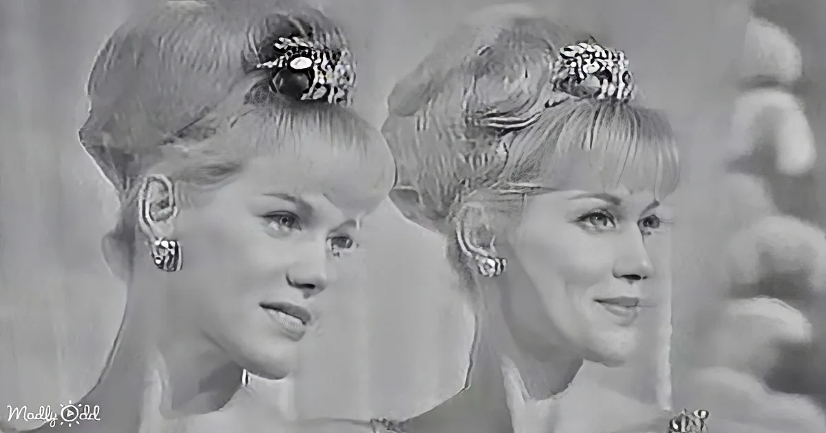 Two women with blonde hair styled in buns, wearing earrings, and a black and white filter.