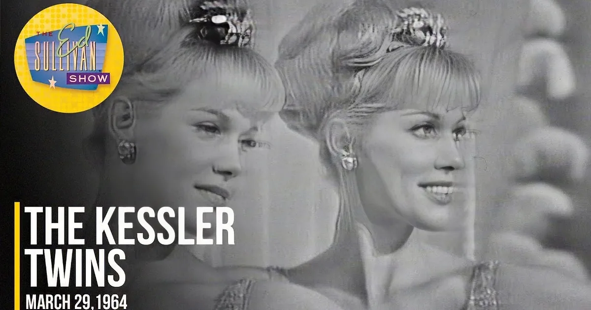 Two women in matching outfits, smiling, with a fluffy background, possibly from a vintage film or performance.