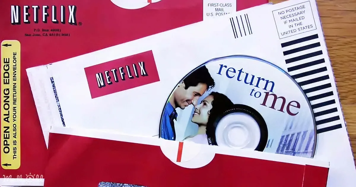 A Netflix DVD return envelope with "Return to Me" movie cover and barcode.