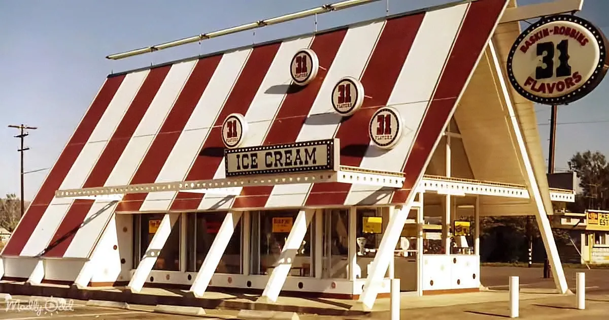 A vintage Baskin-Robbins ice cream shop with a distinctive red and white striped awning and "31 Flavors" sign.