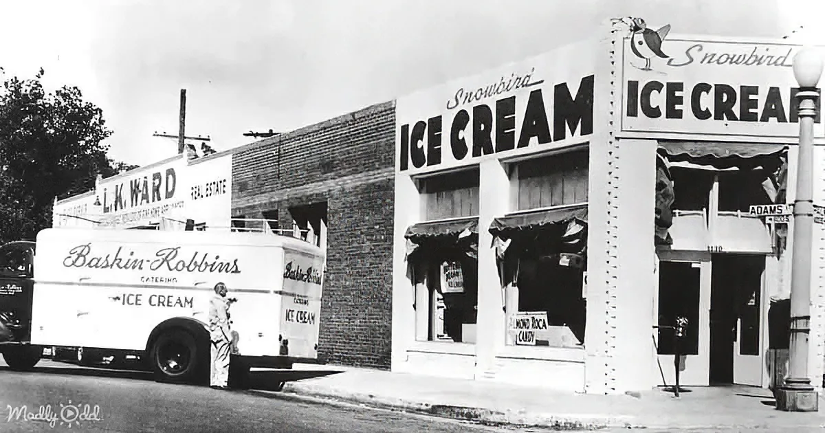 A vintage Baskin-Robbins ice cream truck is parked outside a Snowbird Ice Cream shop.