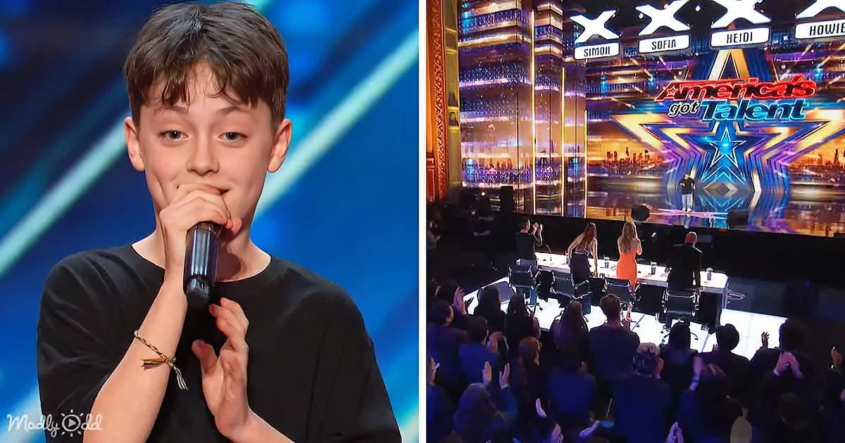 A young boy sings passionately into a microphone on stage at America's Got Talent.