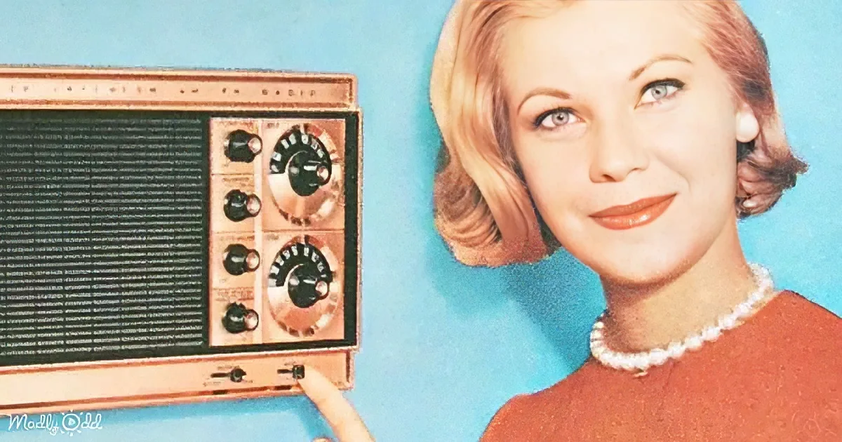 A woman in a red dress and pearl necklace holds a vintage radio against a blue background.