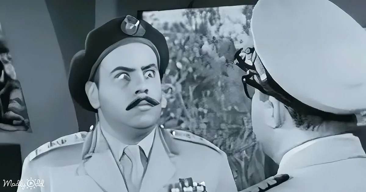 A man in a military uniform with a mustache looks up, seemingly surprised or concerned.
