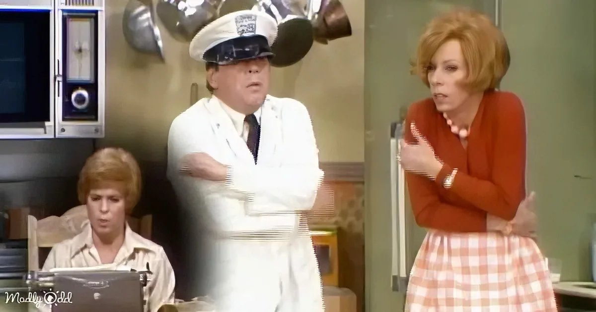 A man in a white lab coat and hat stands with arms crossed, while a woman in an orange top and checkered skirt gestures...