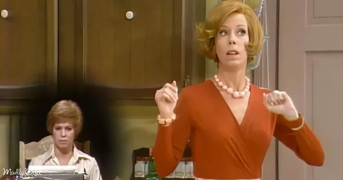 A woman in a red dress gestures emphatically while another woman sits in the background.