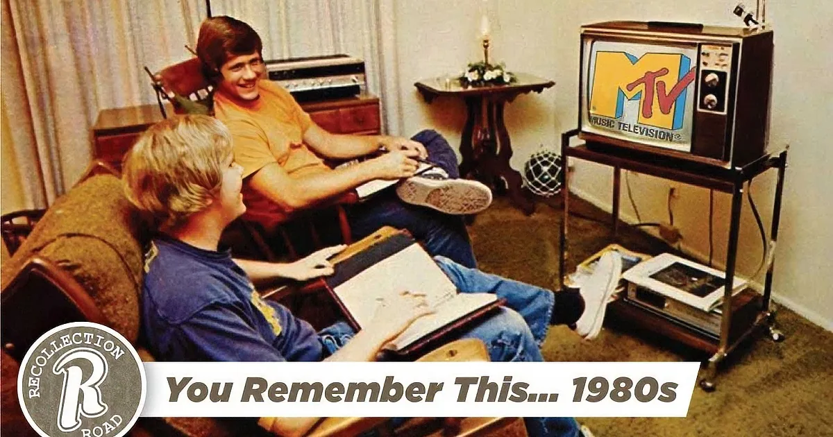 Two children play Pac-Man in a retro arcade, while a cassette tape labeled "My Ultimate 80s Mix" sits nearby.