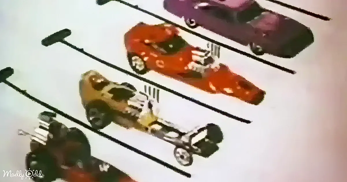 A collection of toy cars with unique designs and colors, displayed on a white surface.