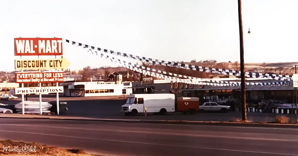 A vintage Walmart sign advertises "Discount City" with a white van and cars parked in front.