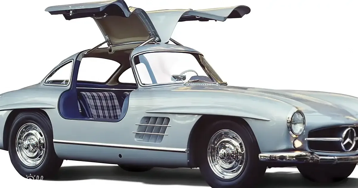 A classic Mercedes-Benz sports car with gull-wing doors open, showcasing its elegant design and luxurious interior.