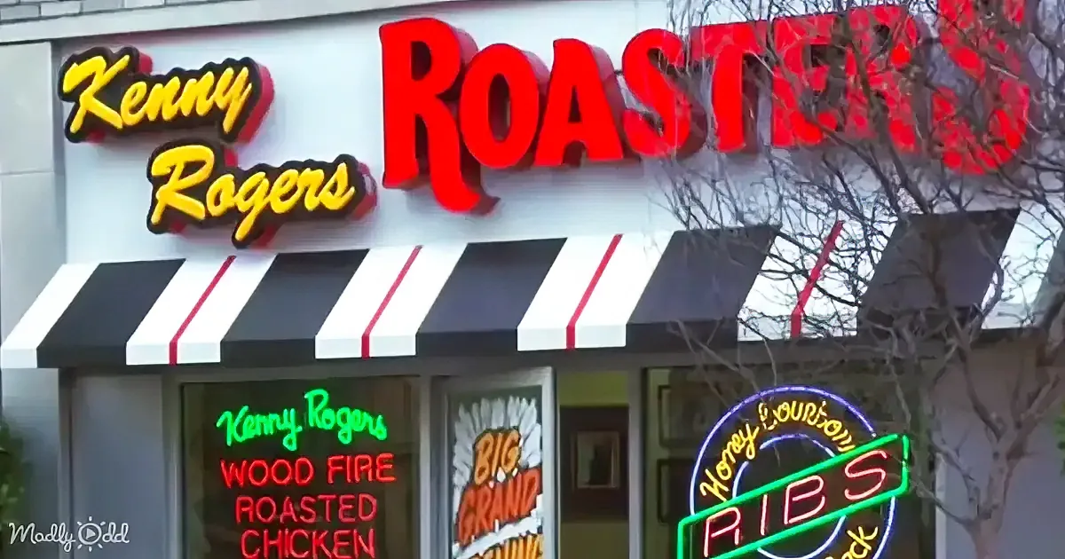 Kenny Rogers Roasters restaurant sign with "Wood Fire Roasted Chicken" and "Big Grand" neon lights.