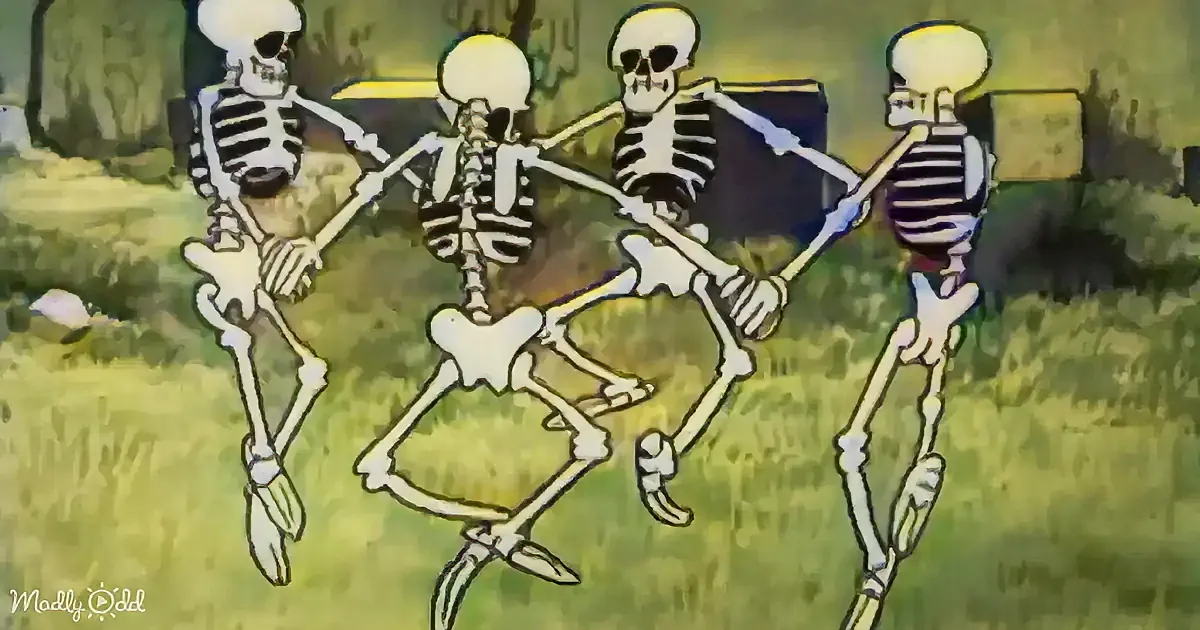 Four skeletons dance in a line, holding hands, with a grassy background and a tree.