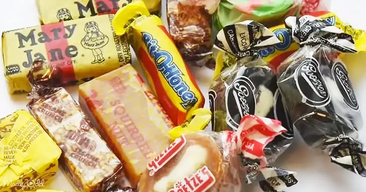 A variety of wrapped candies, including Mary Jane, Old Fashioned Honey, and Squirrel Crunch, are displayed.