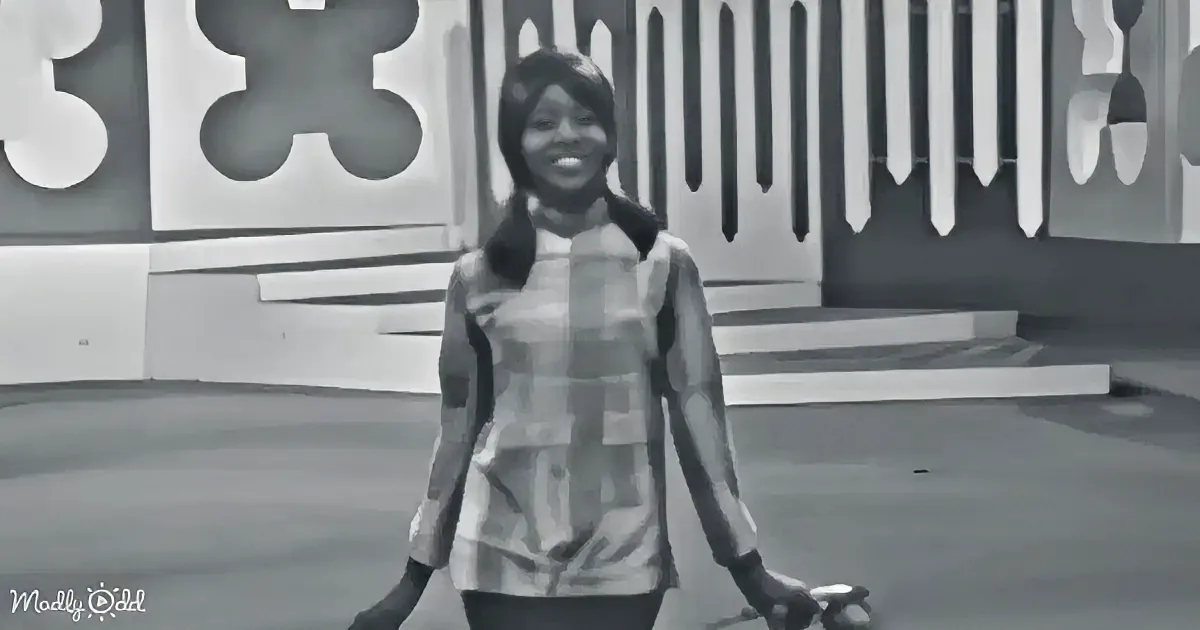 A smiling woman in a striped shirt walks with a bicycle, set against a modern, geometric background.