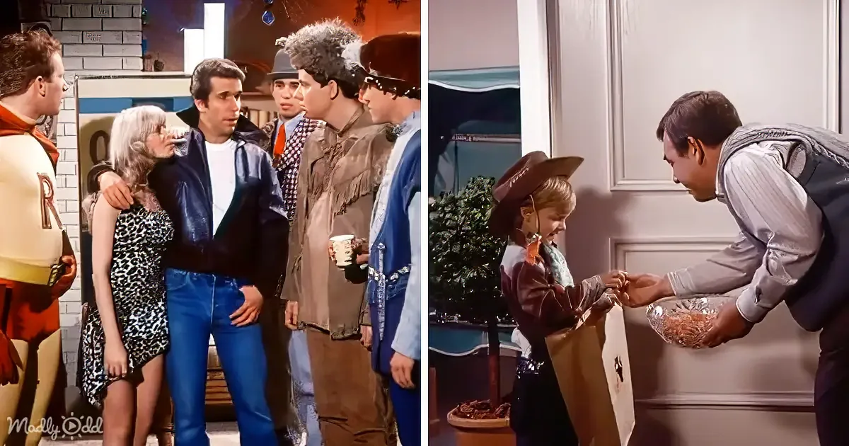 A man in a cowboy hat hands a gift to a child, while others watch in a cozy indoor setting.