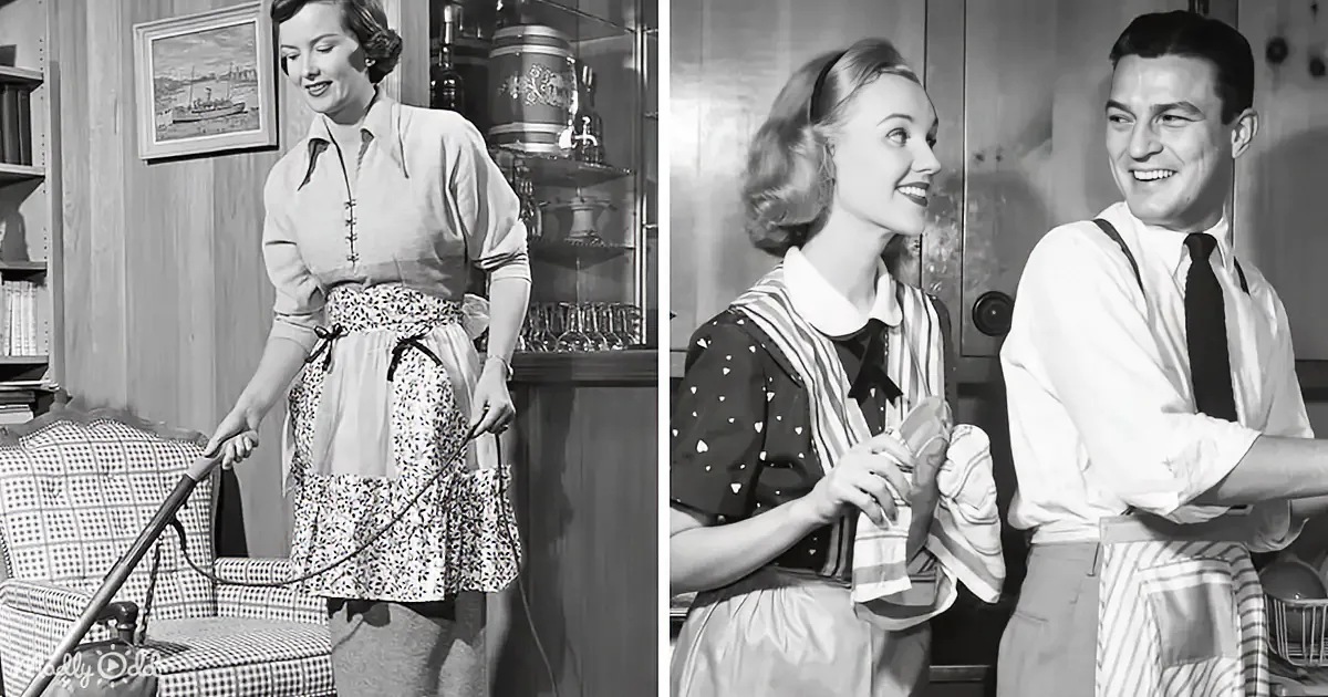 A woman in a floral apron is vacuuming, while a man in suspenders and a tie looks on, both in a vintage home setting.
