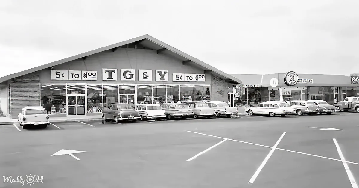 A vintage TG&Y store with cars parked in front, sign reading "5¢ to $1.00," and a 31 Ice Cream sign nearby.