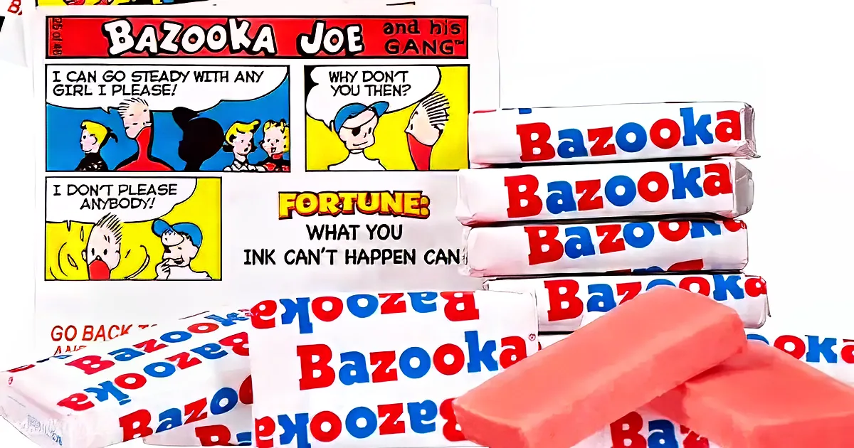 Stack of Bazooka bubblegum packages with comic strip and fortune card.