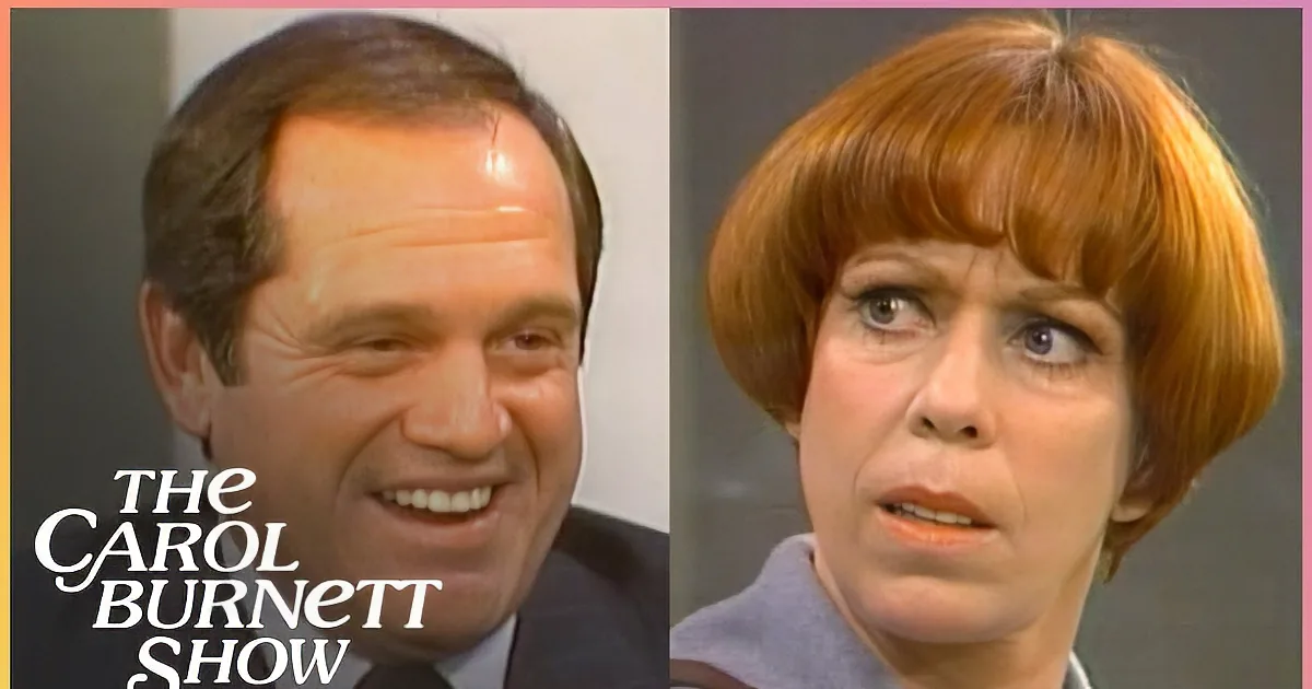 A woman with short red hair and a man in a suit and tie are both smiling in the image.