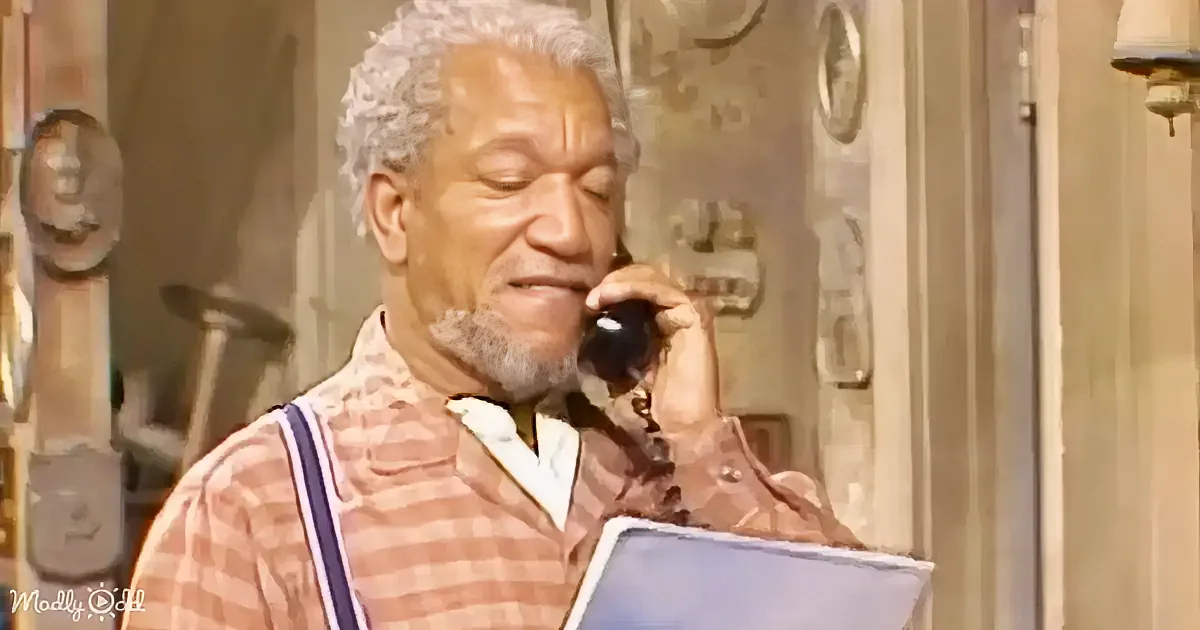 An older man in a plaid shirt holds a phone to his ear and looks at a piece of paper.